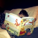 Liam reading his favorite Winnie the Pooh stories
