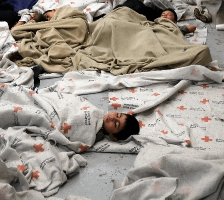 Child detainees sleep in a holding cell at a US Customs and Border Protection processing facility (Reuters/Eric Gay/Pool)